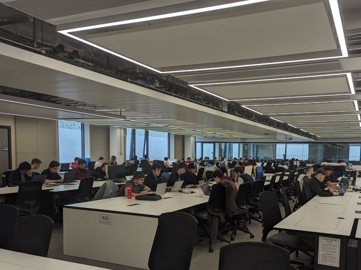 NUCATS members working at a BAE hackathon.